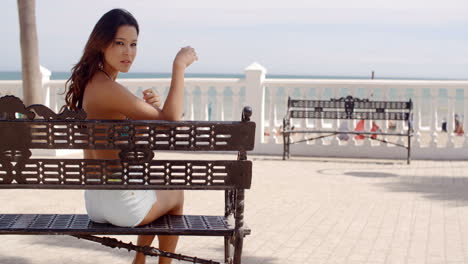 happy young woman relaxing in the sun at the sea