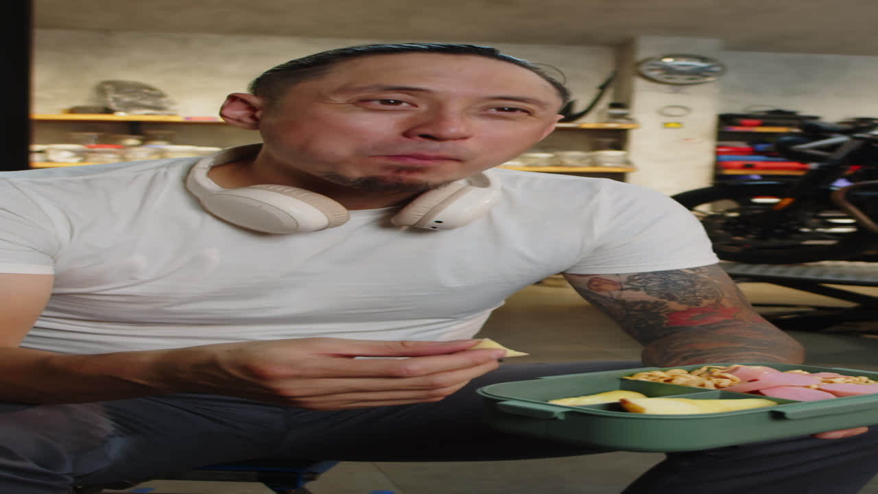 Multiethnic Specialist Eating Lunch Having Break in Garage