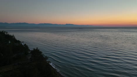 aerial view pushing from whidbey island to the olympic mountains in washington state