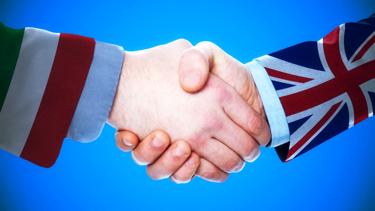animación conceptual de apretón de manos entre italia y el reino unido sobre países y política con el canal matte