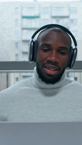 man in headphones on video call