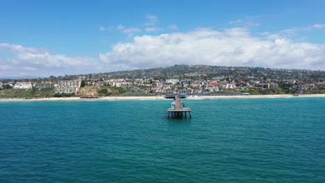 4k Aerial Video flying towards San Clemente Pier, California, with sunny blue skies, 2023