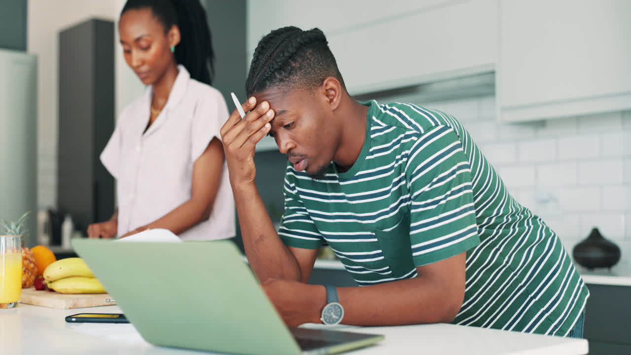 Couple Stressed Over Finances in Kitchen