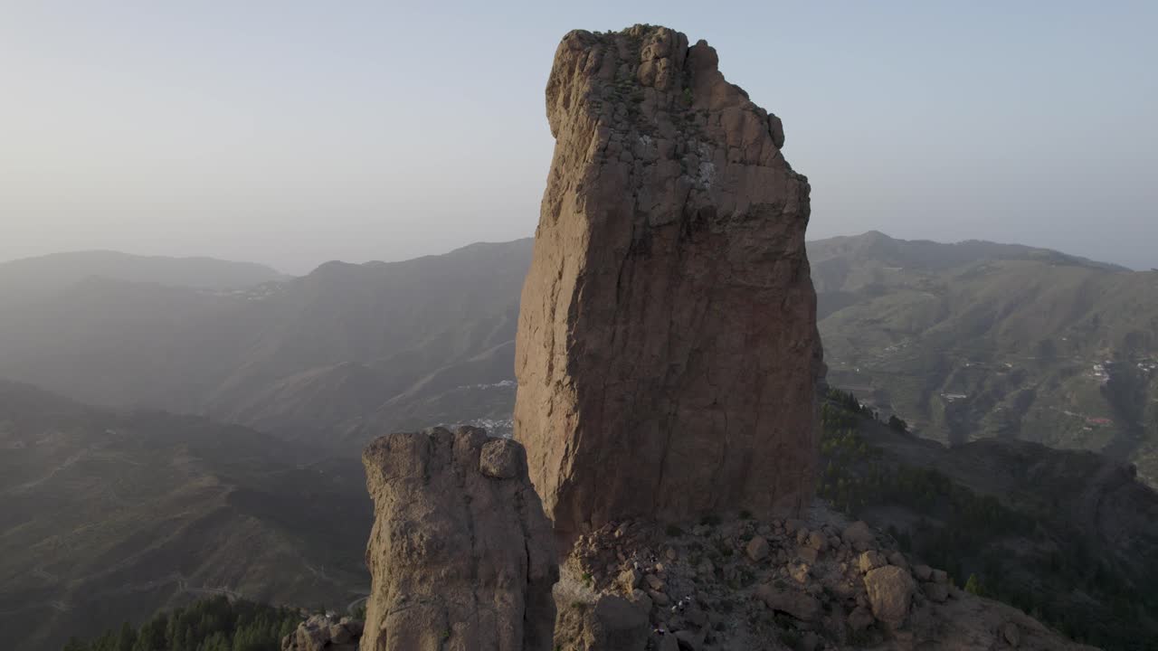 Close up aerial view of the volcanic rock Roque Nublo on the island of Gran Canaria at sunset.