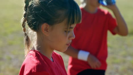 girl drinking water in the boot camp