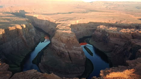 aerial shot of horseshoe bend and colorado river at sunset, arizona