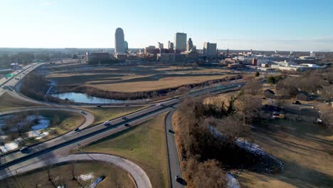 aerial-push-in-to-winston-salem-nc,-north-carolina-with-traffic-in-foreground