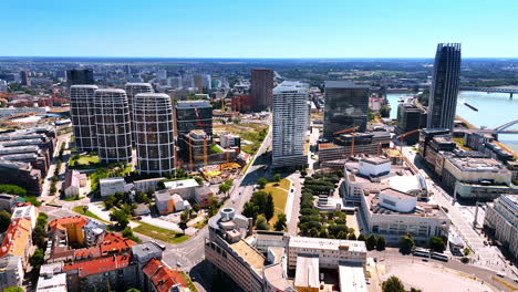 cityscape of modern bratislava, slovakia. drone footage of the contemporary high-rising apartments in the new city center near the danube river. aerial view.