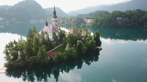 close up aerial view of a church in the middle of lake bled in slovenia's countryside