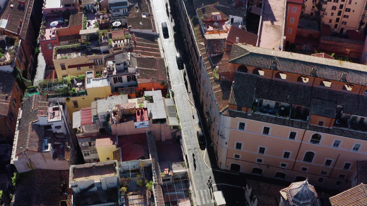 Aerial Top Down View of Rome Historic District with Terracotta Roofs, Old Residential Buildings and Narrow Street. Classic Italian Cityscape in Sunny Daylight.