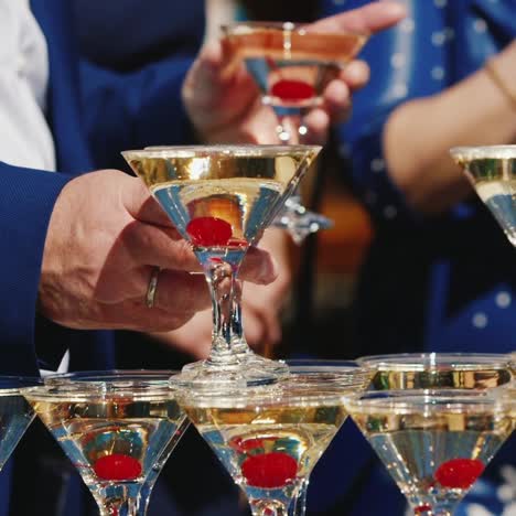 The-Waiter-In-A-White-Shirt-Pours-Wine-Into-The-Pyramid-From-The-Glasses-2