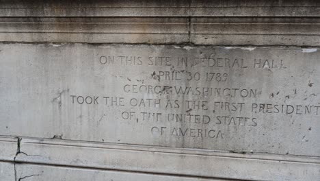 federal hall inscription at the base of the george washington statue