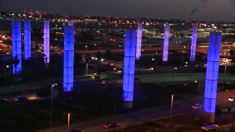 an overview of los angeles international airport at dusk with traffic driving