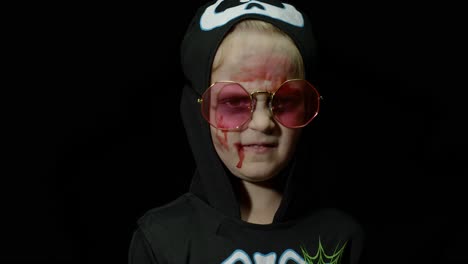 a young child dressed up as a skeleton for halloween