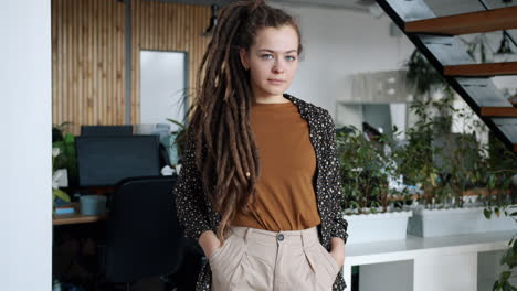 woman with dreadlocks in a modern office