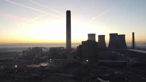 Fiddlers-Ferry-power-station-aerial-view-establishing-partial-demolished-cooling-towers-wreckage-in-early-morning-sunrise