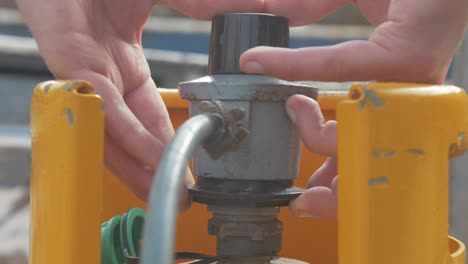 attaching a valve to a propane gas bottle