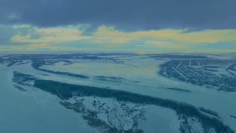 beautiful winter landscape, frozen rivers and lakes in ice. forest stands on the banks, the snow cover on the water. natural expanses, frosty winter day. 4k, prores