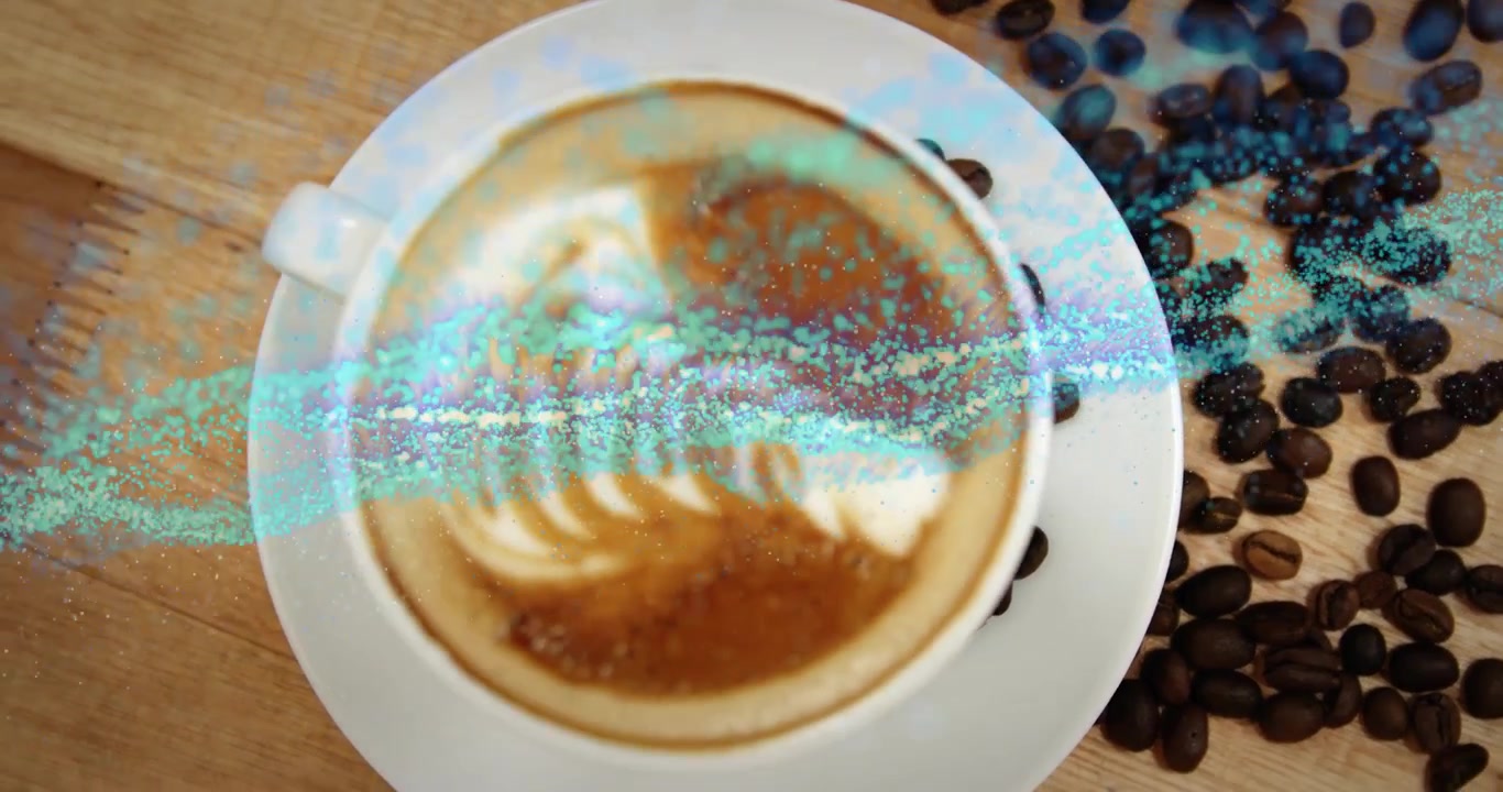 Particelle blu che emergono a destra, si diffondono sui chicchi evidenziando la latte art in design piatto.