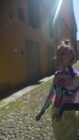 stylish woman in a colorful outfit on a city street