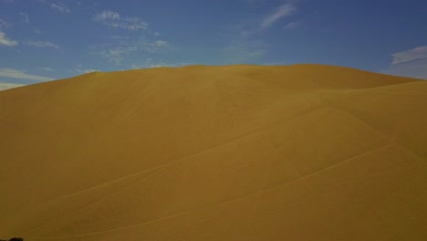 sand dune hilltop near huacachina, peru