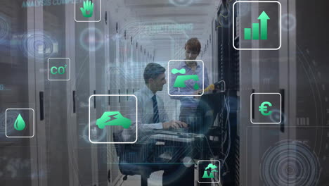 Animation-of-icons,-circles-over-caucasian-engineers-using-laptop-to-check-data-server-system