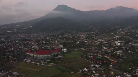 aerial footage of the royal orchid garden hotel in batu, east java indonesia, on a misty morning