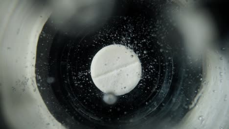dissolving pill in water