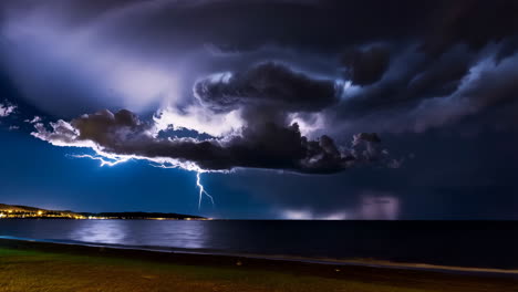dramatic lightning storm over the sea at night