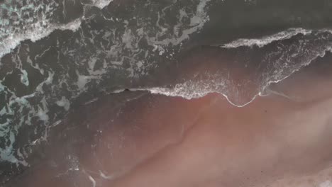 aerial top shot of waves on baltic sea