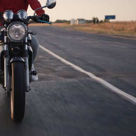motorcyclist rides on the road with bumps