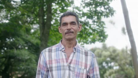 delighted-and-cheerful-Colombian-man-engages-with-the-camera,-conveying-joy-as-he-speaks-with-a-warm-smile,-radiating-positivity-and-charm