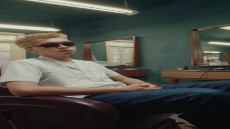 portrait of stylish asian man in barbershop