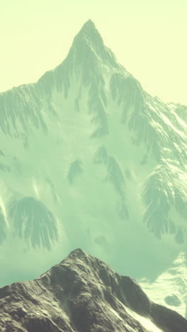 snowy mountain peak with a stunning view of the surrounding mountains