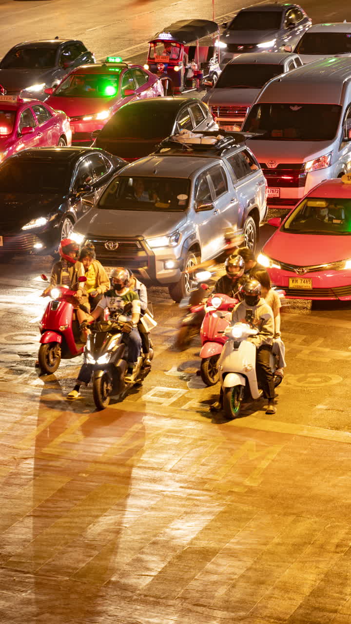 timelapse of rush hour traffic in central bangkok at night in vertical