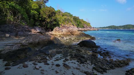 Woman-explores-lonely-dream-beach-on-island