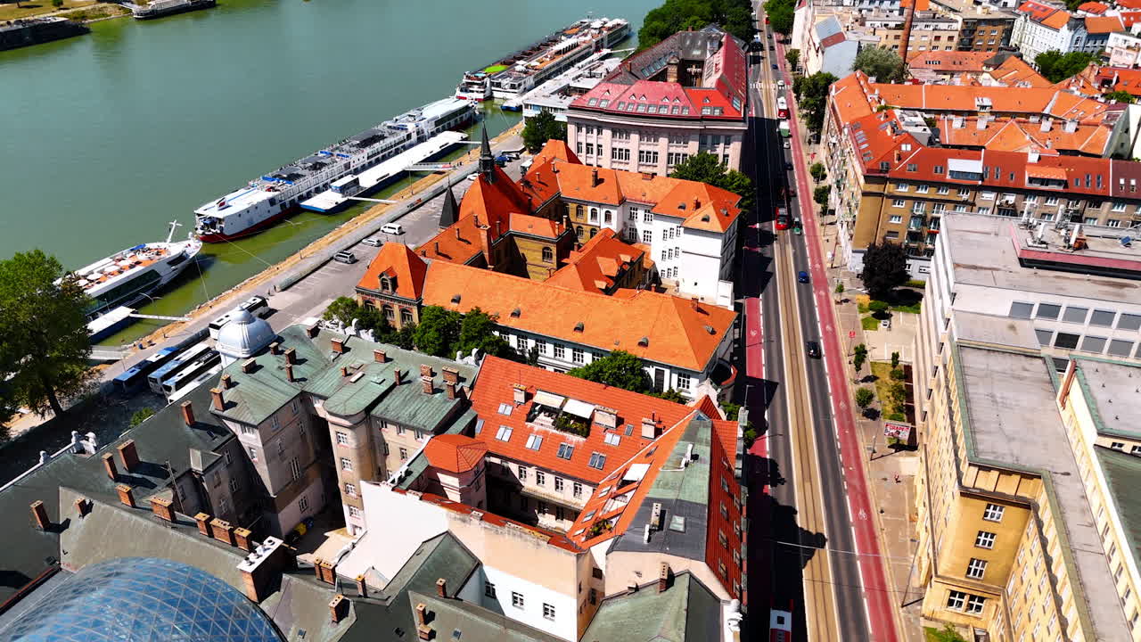 Beautiful old architecture in the old town of Bratislava, Slovakia. Footage over the medieval buildings at the waterfront of the Danube