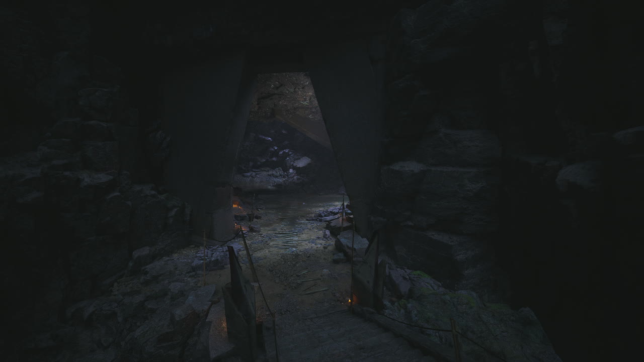 Mysterious cave entrance illuminated by flickering light in ancient terrain