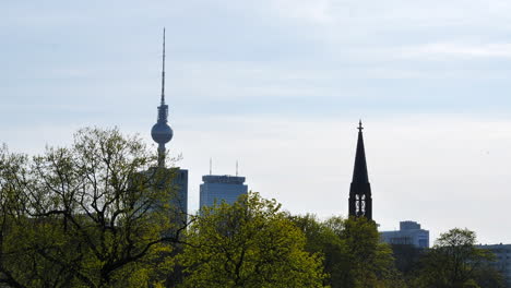View-of-Berlin-skyline,-church-tower-next-to-Fernsehturm-TV-Tower
