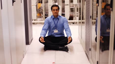 Technician-meditating-in-hallway