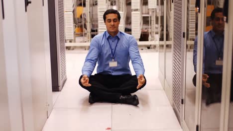 technician meditating in hallway