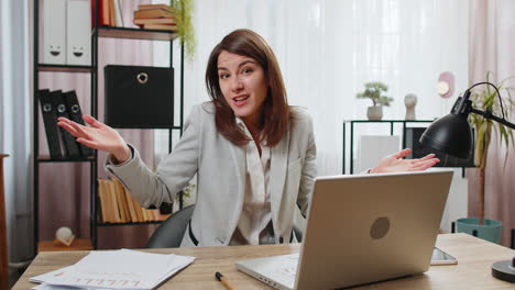 confused businesswoman working on laptop having doubts no answer idea clueless uncertain at office