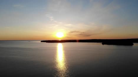 Golden-hour-over-body-of-water-with-water-and-islands