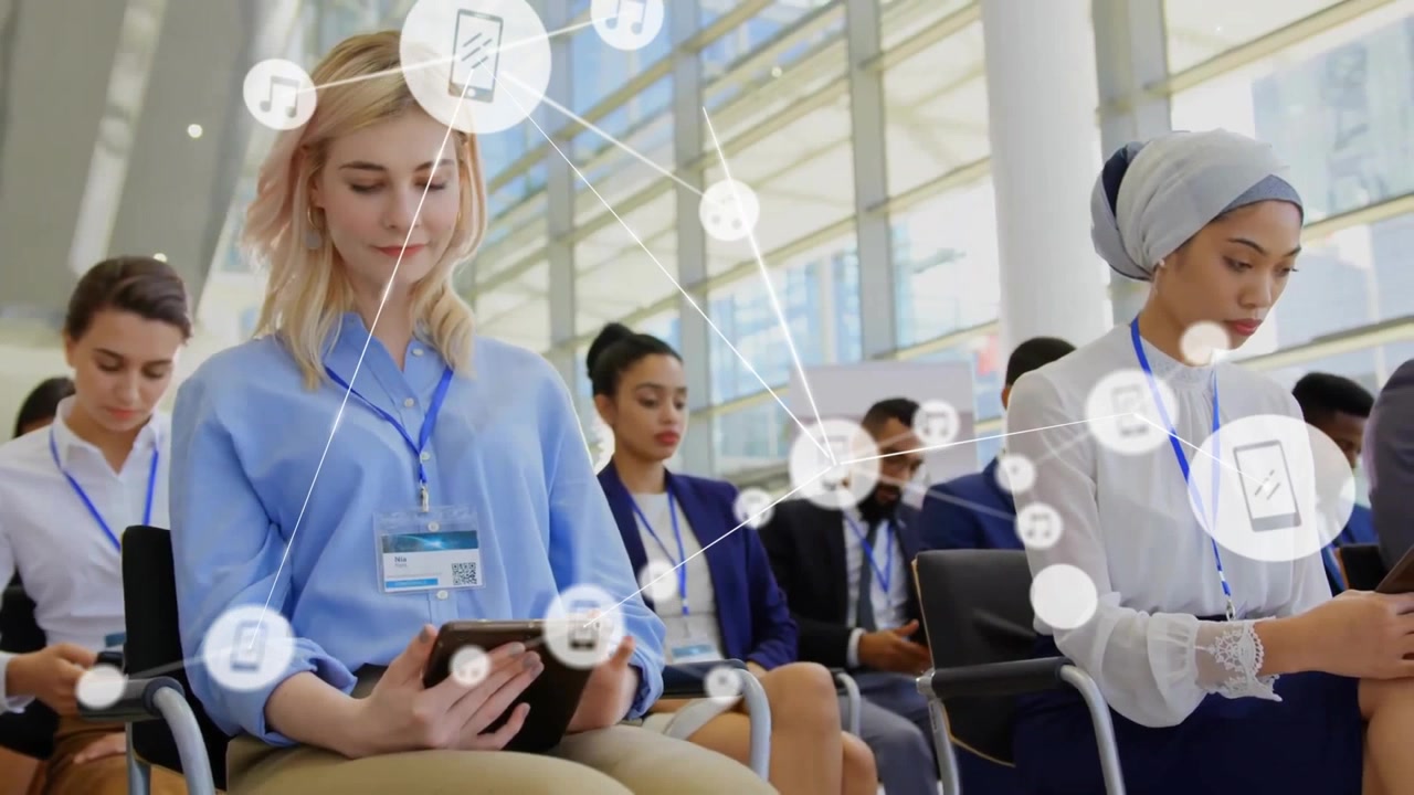 Animation of network of connections with icons over diverse business people in conference