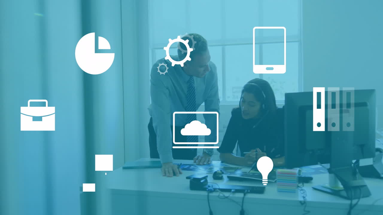 Business icons animation over colleagues discussing work at office desk