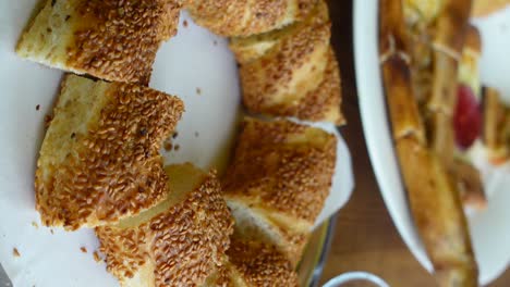 a close up of a simit, a turkish bread with sesame