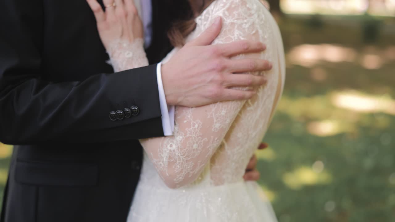 Couple embraces in park, serene moment of love and affection outdoors