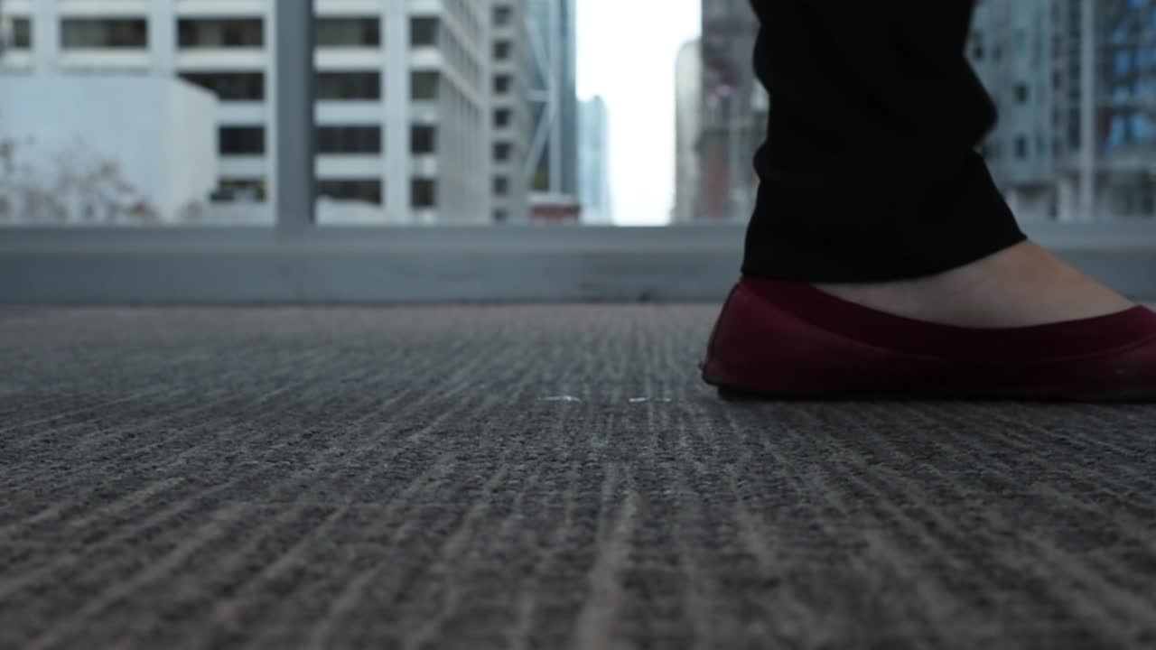 crowd people walking on a corporate envirnment on a plus 15 in downtown calgary with buildings in the background