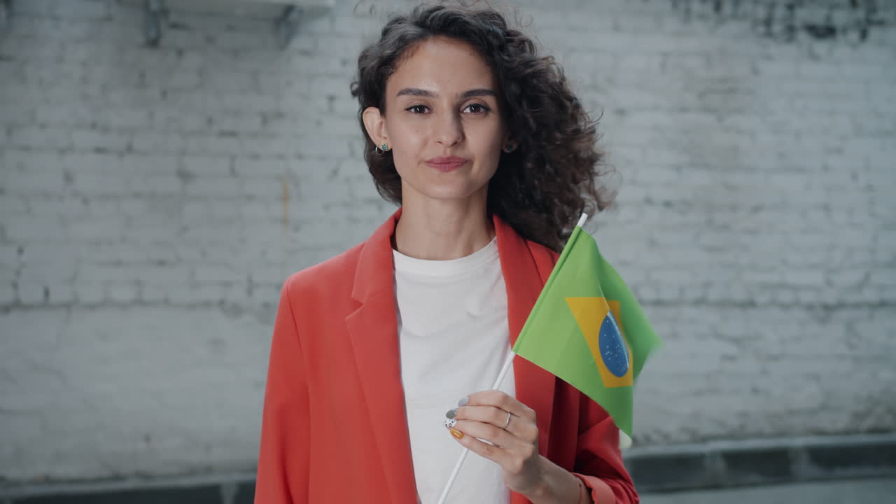Young Woman Holding Brazilian Flag