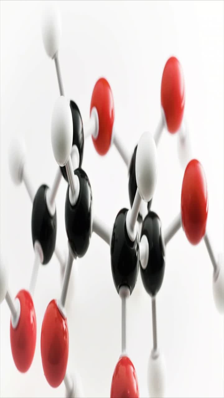 Close-up of a Molecular Model with Red, Black, and White Atoms